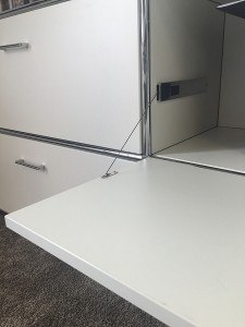 Vorschau: Bosse Solutions Sideboard | Detail Seilzug Klappe | Melamin weiß | Beispielbild Vorschau: Bosse Solutions Sideboard | Detail Seilzug Klappe | Melamin weiß | Beispielbild